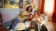 © stockbusters - Relaxed ladies clinking glasses enjoying domestic weekend. Smiling two friends