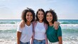 © Vasiliy - A group of three happy young women friends smiling on the beach. Diverse friends enjoying a summer vacation by the ocean