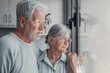 © Daniel - Anxious scared elderly couple embracing, facing troubles together. Family love, senior years in trust, health issue, mutual support empathy in crisis, wife consoling thoughtful husband look out window