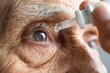 © Studicon - Close-up of senior person using eye drops for dry eyes and vision care