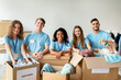 © Prostock-studio - Young volunteers work together in a charity center, sorting clothing donations. They are smiling and engaged, demonstrating teamwork and joy in helping others. This moment captures community spirit.