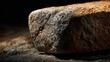 © Juan - Large stone resting on textured ground for natural material visuals and earth tone design background concepts