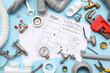 © Pixel-Shot - Composition with plumber's items and house plans on blue background