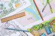 © Pixel-Shot - Zoning plans with ruler and pencils on city map
