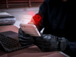 © tete_escape - Romance scam concept showing a cybercriminal using a smartphone to deceive victims with fake love messages. Online dating fraud and social engineering risk through chat applications and social media.