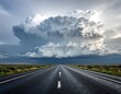 © Agry - Stormy sky on empty straight asphalt highway stretches through a rural mountain landscape toward the horizon where the road to the sky meets a cloud perspective in the green nature countryside
