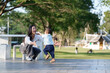 © Phimwilai - Asian mother embracing toddler son in outdoor park