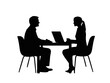 © Dhean - Silhouette of two people sitting at a table with a laptop, in a dimly lit setting