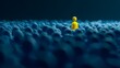 © irawan - A solitary figure in vibrant yellow stands out amidst a sea of blue.