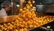 © DigitalSpace - Closeup medium shot of cheesecoated popcorn tumbling on a conveyor belt inside a bustling popcorn production facility. Spices and seasoning dust fill the air.