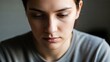 © Nando - Close-up portrait of a person with a contemplative expression, focusing on emotional depth and human connection