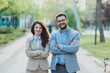 © Novak - Portrait of Two Professional Business People in Suits Standing with Arms Crossed in a Park