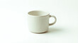 © abdul - Coffee cup, matte off-white glaze texture, subtle hand-made imperfections, soft natural shadows beneath the cup, clean white background.