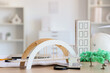 © Pixel-Shot - Architect's supplies with 3D models on table in office, closeup