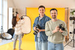 © Pixel-Shot - Male photographers with cameras during master class in studio