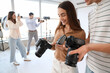 © Pixel-Shot - Photographers with cameras during master class in studio