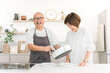 © buritora - Senior couple preparing meals in the kitchen (housework, cooking enthusiast, cooking)