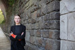 © Westend61 - Self-confident urban teenage girl standing by stone wall in Aachen