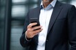 © ttonaorh - Businessman using smartphone in modern office