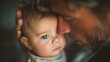 © Maryna - Man holds a baby in his arms. The baby has blue eyes and a small nose. The man is looking at the baby with a gentle expression