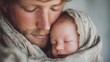 © Maryna - Man is holding a baby in his arms. The baby is wrapped in a blanket and he is sleeping. Concept of warmth and comfort, as the man is providing a safe and nurturing environment for the baby