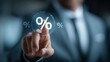 © Ilona - A business professional wears a suit and interacts with a digital interface. The person points at a percentage symbol on a screen, likely for financial reporting or analysis in an office
