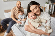 © Bliss - Joyful family moment at home with babies and siblings during cozy afternoon together