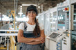 © standret - Modern window making factory, woman in professional uniform is standing