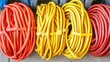 © slamet - Vibrant red and yellow coiled cables close up