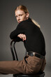 © Bliss - Stylish non binary individual showcasing modern fashion in an artistic studio setting