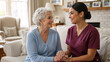 © Vyatcheslav - Compassionate caregiver holding hands with a smiling senior woman. Home healthcare nurse visiting an elderly patient in her living room