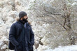 © Antonio Recena - Photograph of a Forty-Year-Old Man with a Long Black Beard in a Frozen Snowy Winter Landscape Wearing a Coat