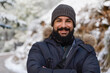 © Antonio Recena - Smiling bearded man in the snow looking at camera