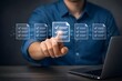 © MstTasmiya - Process automation to efficiently manage files and documentation in enterprise. Man using laptop with document management checking system and online documentation database.