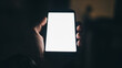 © Its_Pictography - Mobile screen in dim light:A hand delicately cradles a smartphone, its screen emitting a bright, inviting glow within the shadowy expanse.