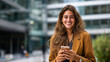 © Kateryna - Faceless confident young businesswoman smiling outside modern office building heavily defocused background anonymous happy professional woman using smartphone in city urban life