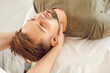 © Studio Romantic - Young man lying on massage table in a spa, relaxing massage session. Masseur use therapeutic techniques, easing muscle tension, neck pain and overall body health through rejuvenating treatment.