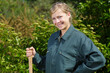 © auremar - picture of female gardener smiling under bright sun