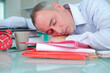 © auremar - exhausted businessman sleeping on the table