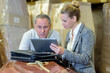 © auremar - businesspeople looking at project on tablet