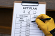 © newlifestock - Lift plan with load chart and pick radius details for crane operation ensuring safety measures are followed during lifting tasks on site