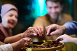 © .shock - Family gathers around a plate of dates to break their fast during Ramadan, sharing smiles and moments of togetherness