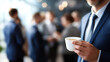 © Kateryna - Faceless happy business people taking coffee break at work heavily defocused office background anonymous professionals with refreshment moment workplace social interaction