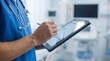 © Furkan - Healthcare doctor using digital tablet for patient data analysis and medical reporting in modern hospital environment.