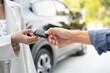 © Shisu_ka - lease, rental car, sell, buy. Dealership manager send car keys to the new owner. Sales, loan credit financial, rent vehicle, insurance,  renting, Seller, dealer, installment, car care business