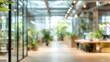 © Happy - Stunning photo of Blurred background of a modern office space with green plants and glass partitions