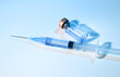 © Anna Hoychuk - Close up of Single use Syringe Next to Glass Vial