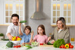 © New Africa - Happy family cooking together at table in kitchen