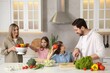 © New Africa - Happy family cooking together at table in kitchen