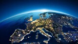 glowing city lights of europe seen from a satellite perspective during night time
